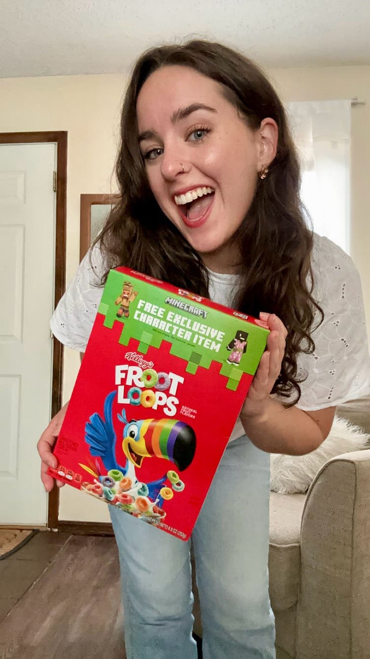 Woman holding a box of Froot Loops